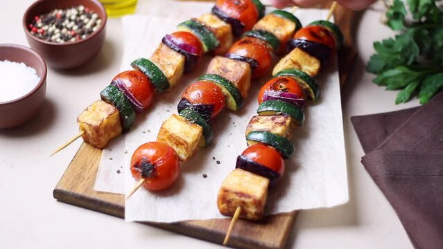Grilled skewers with halloumi cheese, zucchini, tomatoes and onions. Kebab. Healthy eating. Vegetarian food.