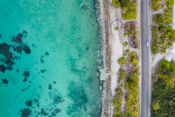 Aerial view of tropical beach landscape and local road at addu city, the southernmost atoll of Maldives in Indian ocean. Maldives tourism and summer vacation concepts