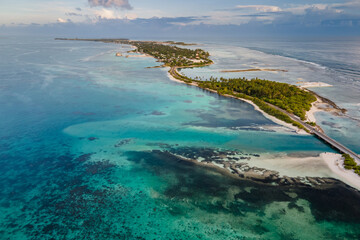 Aerial view of tropical beach landscape and local road at addu city, the southernmost atoll of Maldives in Indian ocean. Maldives tourism and summer vacation concepts - obrazy, fototapety, plakaty