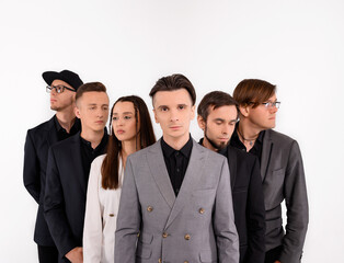 Six caucasian young people posing on a white background in the studio. Medium plan