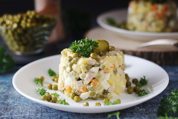 Olivier salad, traditional Russian dish, served on the plate