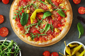 Pizza diavolo flat lay with pepper