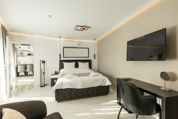 Fototapeta na wymiar Interior of a luxury double bed hotel bedroom with black and white furniture
