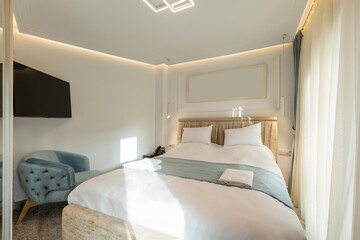 Interior of a small luxury double bed hotel bedroom