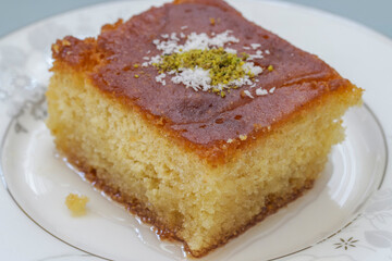 Delicious turkish pastry with syrup revani over a white plate