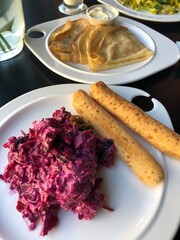 Beetroot salad with prunes and cheese bread