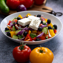 salad greek rustic salad rom tomatoes  sweet peppers cucumbers feta  shallots and olives seasoned with olive oil  salt black pepper oregano
