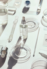 serum in petri dishes on light background cosmetic research concept