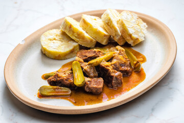 beef meat with picles sauce and dumplings