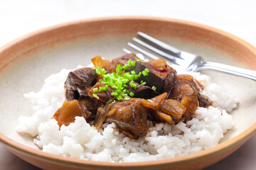 Chinese beef meat with soy sauce served with rice