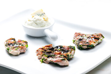 grilled poultry meat with herbs served with blue cheese dip