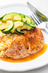 pork meat with zucchini salad and couscous