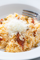 Italian risotto with dry tomatoes and capers
