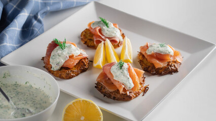 snack of smoked salmon on a white plate