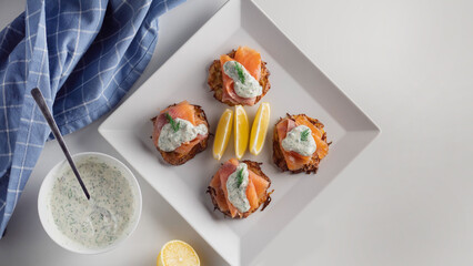 snack of smoked salmon on a white plate