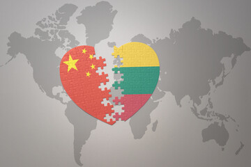 puzzle heart with the national flag of china and lithuania on a world map background. Concept.