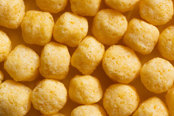 top view of puffed, delicious and salty cheese pops