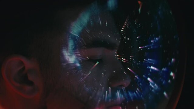 Astronaut looks out of the spacecraft on a mission into space among the stars