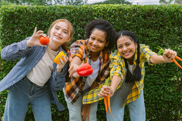 Smiling students Different ethnicities in farm vegetable. Teen age mix race happy and smile holding  vegetables fresh from farm 