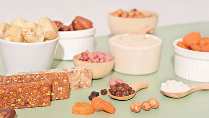 Healthy lifestyle and raw vegan food concept. homemade energy bars and dried fruits and nuts.