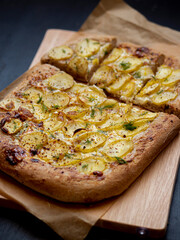 pizza square-shaped  with new potatoes