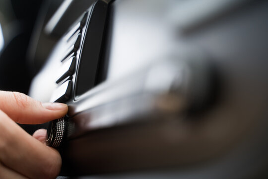 Close-up - the person makes the sound louder in the car. Listen to music in the automobile