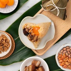 Zongzi. Rice dumpling for Dragon Boat Festival on bright marble table background with ingredient.