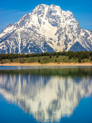 The Grand Teton Mountain view at the waters of Colter Bay, inside the Grand Teton National Park, Wyoming, USA