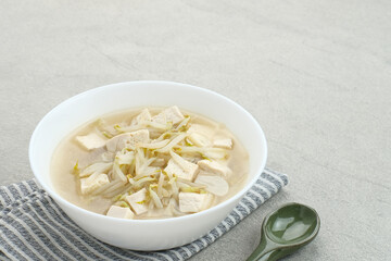 Ca Tauge or Tumis Tauge,  Indonesian stir fried bean sprouts mixed with tofu, served in white bowl. Selected focus.
