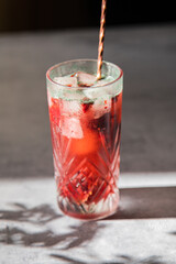Pink berries lemonade in a clear glass