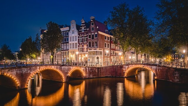 Amsterdam, Netherlands bridges and canals at twilight.