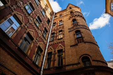 Saint Petersburg, Russia, 17 October 2021: Kolokolnaya Street profitable house with kokoshniks on facade by Nikolai Nikonov, Neo-Russian style, naked brickwork and multi-colored tiles, hipped roofs
