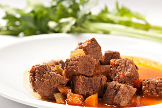 Hot beef stew on a plate. High quality photo.