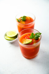 Homemade tomato cocktail with fresh lime