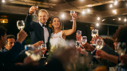 Beautiful Bride and Groom Celebrate Wedding at an Evening Reception Party. Newlyweds Propose a...