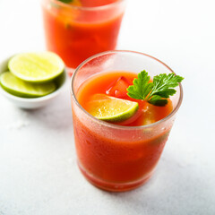 Homemade tomato cocktail with fresh lime
