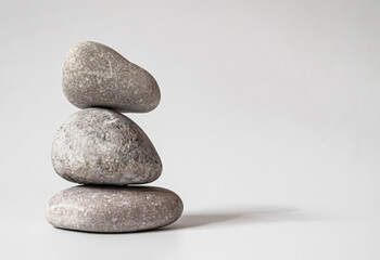 Fototapeta na wymiar Stack of white natural zen stones. your mind, your soul balancing, begging, meditation concept. 