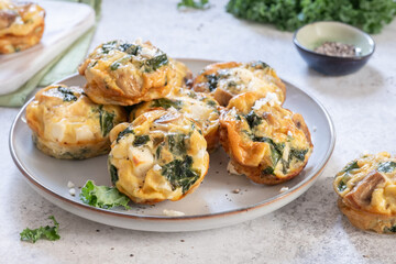 Vegetarian egg muffins with mushroom, green kale and feta cheese for Healthy keto diet Breakfast or...