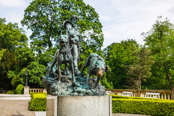 Statue man with dogs at Medieval Konopiste castle gardens