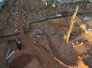 Deep foundation machine. Drilling rig and Pile driver at construction site. Pile driven into ground...