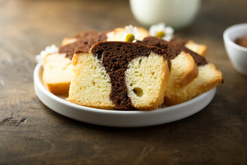 Fototapeta na wymiar Homemade vanilla chocolate marbled cake on a plate