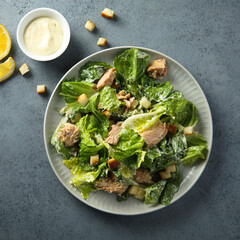 Homemade salad with croutons and salmon