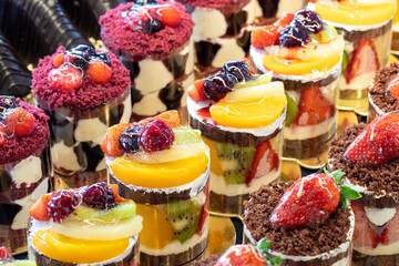 Types of cakes. Cakes on display at the patisserie counter. close up