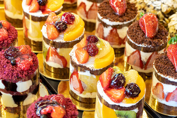 Types of cakes. Cakes on display at the patisserie counter. close up