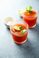 Homemade tomato cocktail with fresh lime