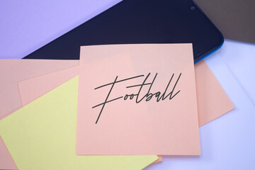 Football. Text on adhesive note paper. Event, celebration reminder message.