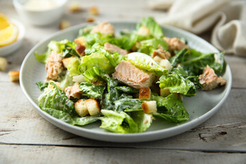 Homemade salad with croutons and salmon