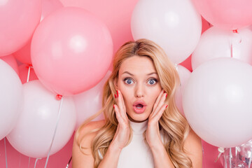 Photo of impressed young lady arms touch cheeks stare speechless isolated on pink color background