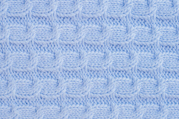 Fototapeta na wymiar blue knitted wool texture. baby plaid seamless pattern. Desktop wallpaper pigtail knitting