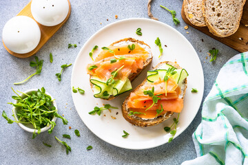 Open sandwich with cream cheese, salmon and cucumber.